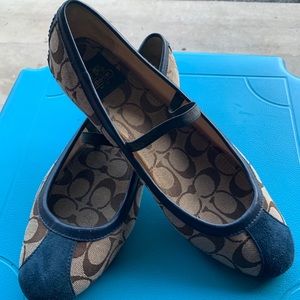 Coach with navy blue trim